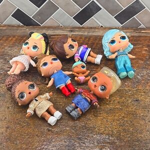 Lol doll. Bundle of 6 regular size and 1 baby size doll.